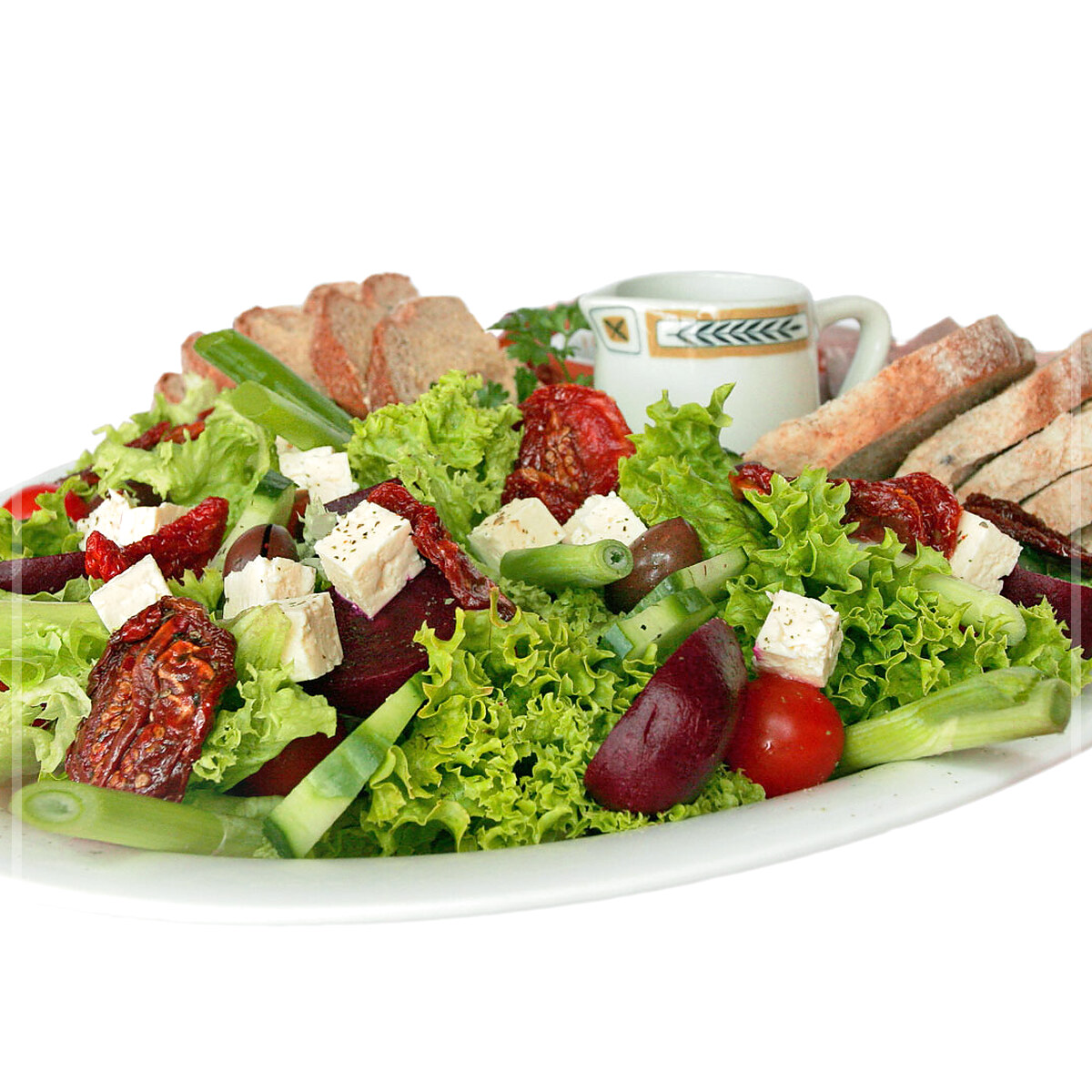 A plated serving of Green Salad With Honey-Mustard Dressing