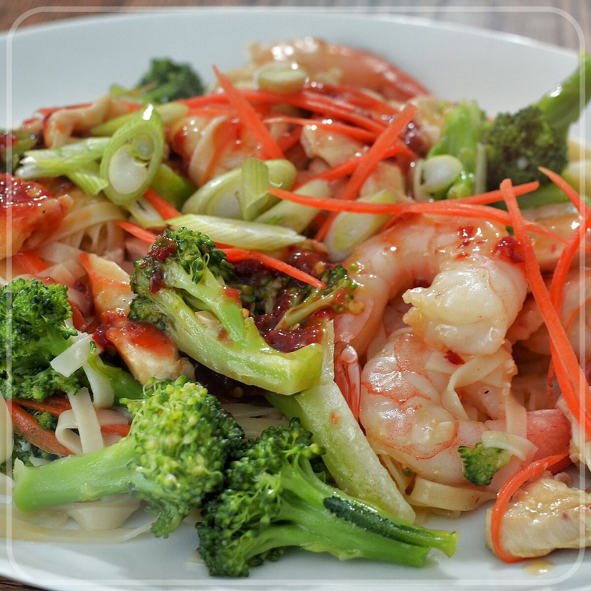 A plated serving of Noodle Stir-Fry With Chicken And Broccoli