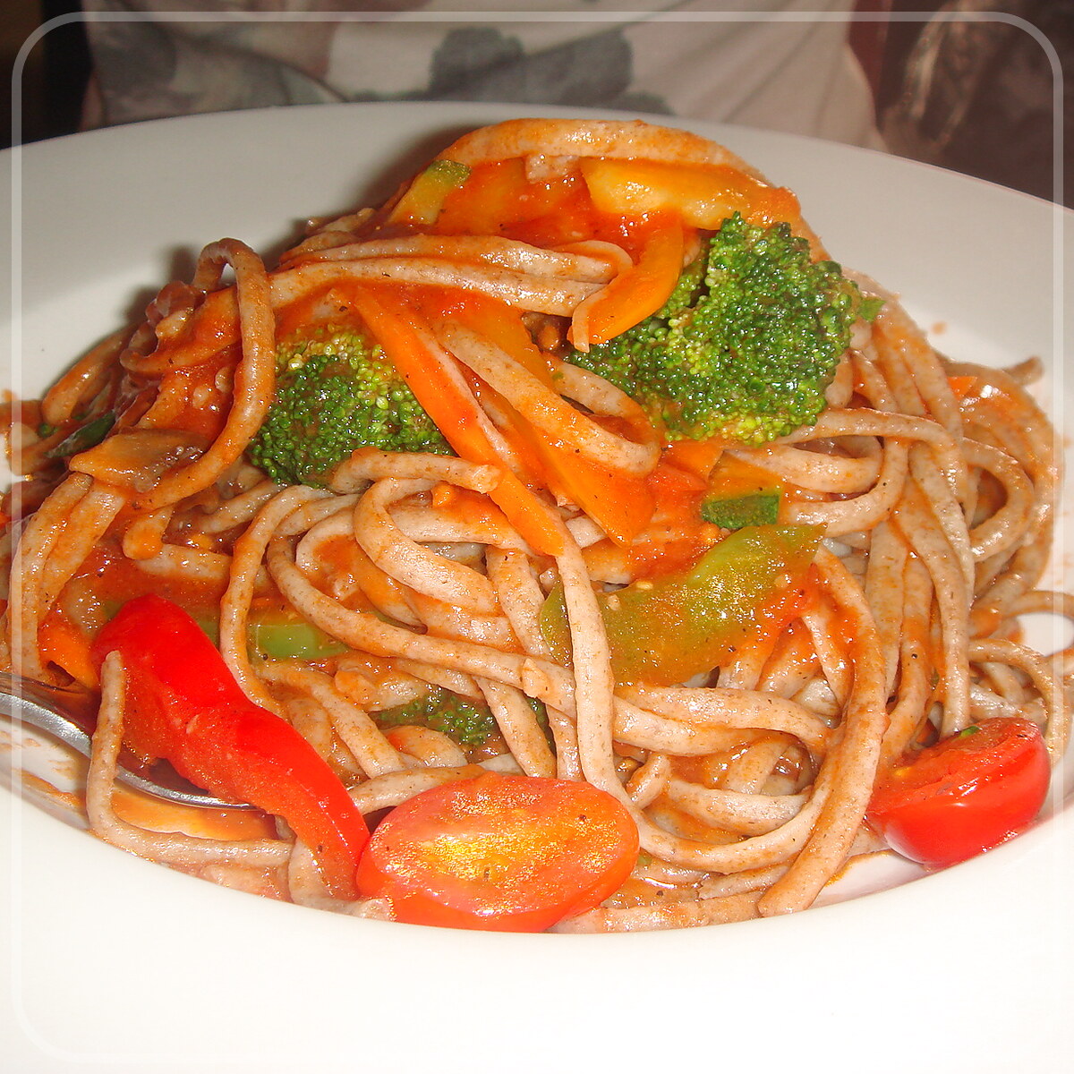 A plated serving of Noodles And Vegetables En Papillote