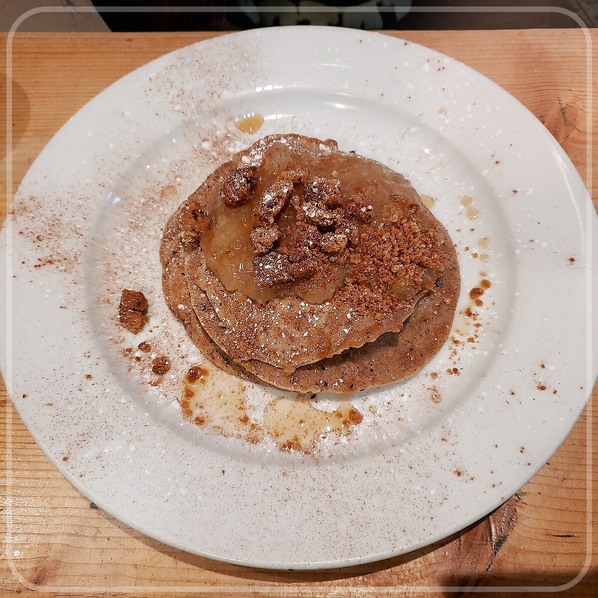 A plated serving of Upside Down Apple Pancake